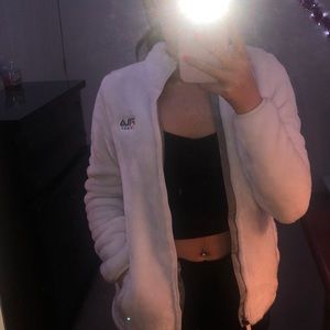 white furry fila jacket